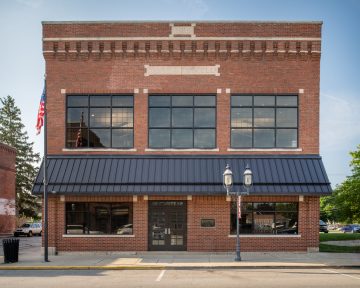 View of JRF Construction’s Cicero office, showcasing a brick exterior with large windows and modern design accents.