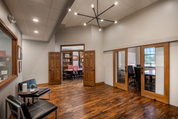 View of JRF Construction’s Cicero office, showcasing a brick exterior with large windows and modern design accents.