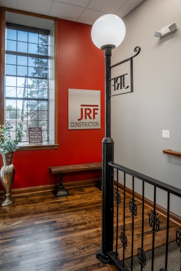 View of JRF Construction’s Cicero office, showcasing a brick exterior with large windows and modern design accents.